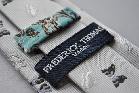 silver grey tie with butterfly embroidered design